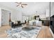 Contemporary living room offering hardwood floors, an open layout, and seamless flow to the kitchen at 237 Altoona Sw Pl, Atlanta, GA 30314