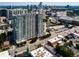 Stunning aerial view of a high-rise apartment building surrounded by lush greenery and a vibrant cityscape at 250 Pharr Ne Rd # 318, Atlanta, GA 30305