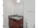 Bathroom featuring dark wood vanity with granite countertop, mirror, and toilet at 250 Pharr Ne Rd # 318, Atlanta, GA 30305