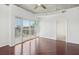 Bright bedroom with hardwood floors, white walls, and a sliding glass door leading to a balcony at 250 Pharr Ne Rd # 318, Atlanta, GA 30305