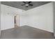 A bright primary bedroom with exposed concrete ceiling and access to a bathroom at 250 Pharr Ne Rd # 318, Atlanta, GA 30305