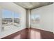 Bright bedroom with hardwood floors, white walls, concrete ceiling and multiple windows offering ample natural light at 250 Pharr Ne Rd # 318, Atlanta, GA 30305