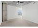 A bright primary bedroom with exposed concrete ceiling and a large picture window at 250 Pharr Ne Rd # 318, Atlanta, GA 30305