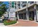 Modern high-rise building exterior with stylish entrance and signage for 'Eclipse' and various businesses at 250 Pharr Ne Rd # 318, Atlanta, GA 30305