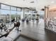 Modern gym with cardio machines, free weights, and large windows offering city views at 250 Pharr Ne Rd # 318, Atlanta, GA 30305