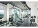 Well-equipped gym with weight machines, free weights, and floor-to-ceiling windows overlooking the city at 250 Pharr Ne Rd # 318, Atlanta, GA 30305