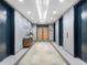 Modern hallway with neutral tones, contemporary lighting, and convenient elevator access for residents and guests at 250 Pharr Ne Rd # 318, Atlanta, GA 30305