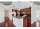 Modern kitchen with stainless steel appliances, dark wood cabinets, granite countertops, and a kitchen island at 250 Pharr Ne Rd # 318, Atlanta, GA 30305