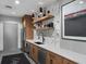 Modern kitchen features sleek countertops, stainless steel appliances, and stylish floating shelves at 250 Pharr Ne Rd # 318, Atlanta, GA 30305