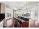 Open-concept living room featuring hardwood floors, modern kitchen, and a large windows and doorway at 250 Pharr Ne Rd # 318, Atlanta, GA 30305