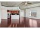 Open-concept living room featuring hardwood floors, modern kitchen, and a large window with natural light at 250 Pharr Ne Rd # 318, Atlanta, GA 30305