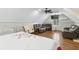 Large bedroom featuring a cozy seating area, sloped ceilings, and hardwood floors at 4970 Lakeland Woods Ct, Atlanta, GA 30338