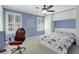 Stylish bedroom features ample closet space, ceiling fan, and soft natural light at 4970 Lakeland Woods Ct, Atlanta, GA 30338