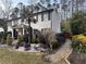 Beautiful home featuring well-maintained landscaping, a stone pathway, and lush greenery at 4970 Lakeland Woods Ct, Atlanta, GA 30338