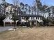 Inviting two-story home with a spacious driveway and beautiful palm trees enhancing its curb appeal at 4970 Lakeland Woods Ct, Atlanta, GA 30338