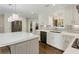 Bright kitchen features white cabinetry, stainless steel appliances, and a view of the backyard at 4970 Lakeland Woods Ct, Atlanta, GA 30338