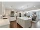 A spacious kitchen featuring white cabinets, an island with seating, and an open layout at 4970 Lakeland Woods Ct, Atlanta, GA 30338