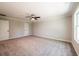 Spacious bedroom featuring a ceiling fan, neutral walls, and plush carpeting at 1624 Ruskin Way, Marietta, GA 30062
