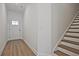 Welcoming entryway with wood-look flooring and staircase at 1624 Ruskin Way, Marietta, GA 30062