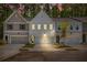 Charming townhome with a two-car garage, freshly manicured lawn, and inviting curb appeal at 1624 Ruskin Way, Marietta, GA 30062