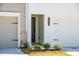 This home has a clean front entrance with a two-car garage and manicured landscaping at 1624 Ruskin Way, Marietta, GA 30062