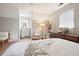 Comfortable bedroom with a cozy seating area and stylish decor accents at 345 Lambeth Dr, Hiram, GA 30141