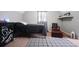 A modern bedroom with black color schemes, plaid area rug, and plenty of space to relax or entertain at 345 Lambeth Dr, Hiram, GA 30141