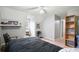 A modern bedroom with shelves, wall art, and plenty of space to relax or entertain at 345 Lambeth Dr, Hiram, GA 30141