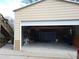 Wide open garage with stairs on the side, offering ample space for parking and storage at 345 Lambeth Dr, Hiram, GA 30141