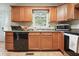 Functional kitchen featuring modern appliances, ample cabinet space, and neutral countertops at 345 Lambeth Dr, Hiram, GA 30141