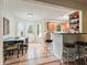Eat-in kitchen features tile floors, breakfast bar with stools, and glass door to the yard at 345 Lambeth Dr, Hiram, GA 30141