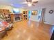 Open living room features a stone fireplace, built-in shelving and light hardwood floors at 345 Lambeth Dr, Hiram, GA 30141
