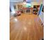 Spacious living room features a stone fireplace, built-in shelving and light hardwood floors at 345 Lambeth Dr, Hiram, GA 30141