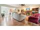 Open concept living room flows into the kitchen with fireplace and wood floors at 345 Lambeth Dr, Hiram, GA 30141