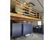 Loft area with exposed wooden beams, a ping pong table below, offering versatile space at 345 Lambeth Dr, Hiram, GA 30141