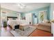 Spacious main bedroom with light-blue walls, ensuite bathroom, and seating area at 345 Lambeth Dr, Hiram, GA 30141