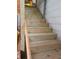 Newly built wooden stairs offering access to the upper level of the storage building and loft at 345 Lambeth Dr, Hiram, GA 30141