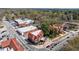 Scenic aerial of Tudor-style commercial buildings with busy streets, offering a glimpse into the local business district at 5 Coventry Close, Avondale Estates, GA 30002