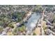Scenic aerial shot showcasing the lake and the residential neighborhood with mature trees at 5 Coventry Close, Avondale Estates, GA 30002