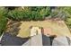 Aerial view showcases the roof and meticulously landscaped backyard with patio at 5 Coventry Close, Avondale Estates, GA 30002