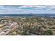 Sprawling aerial shot featuring rooftops and rolling landscape, creating a sense of community surrounded by scenic beauty at 5 Coventry Close, Avondale Estates, GA 30002