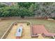 Aerial view of a spacious backyard with deck and brick patio, perfect for outdoor living at 5 Coventry Close, Avondale Estates, GA 30002