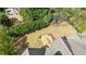 Overhead view displays a manicured lawn, brick patio and deck for outdoor entertainment at 5 Coventry Close, Avondale Estates, GA 30002