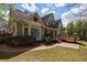 Charming backyard featuring a landscaped yard, patio, and a multi-level deck for outdoor enjoyment at 5 Coventry Close, Avondale Estates, GA 30002