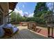 Relaxing backyard deck provides comfortable seating and a serene outdoor dining area at 5 Coventry Close, Avondale Estates, GA 30002