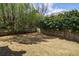 Large backyard featuring a grassy lawn and privacy fence at 5 Coventry Close, Avondale Estates, GA 30002