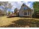 Expansive backyard features a well-maintained lawn, a spacious deck, and mature trees at 5 Coventry Close, Avondale Estates, GA 30002