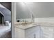 Bathroom featuring white vanity with marble countertop and carpeted flooring at 5 Coventry Close, Avondale Estates, GA 30002