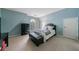 Cozy bedroom showcasing a queen bed, dark wood dresser, an ottoman, and carpeted flooring at 5 Coventry Close, Avondale Estates, GA 30002
