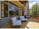Relaxing deck features outdoor chairs and seating area with large windows at 5 Coventry Close, Avondale Estates, GA 30002